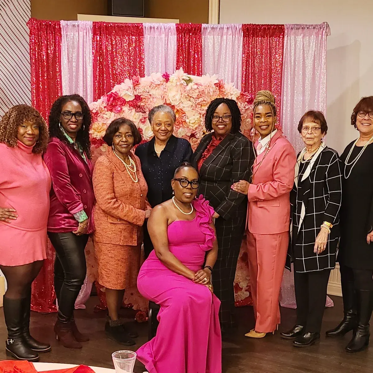 Felicia laughing with sisters at a Just Us Sistahs Talking event